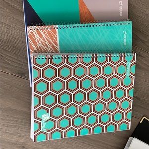 three notebooks never used.